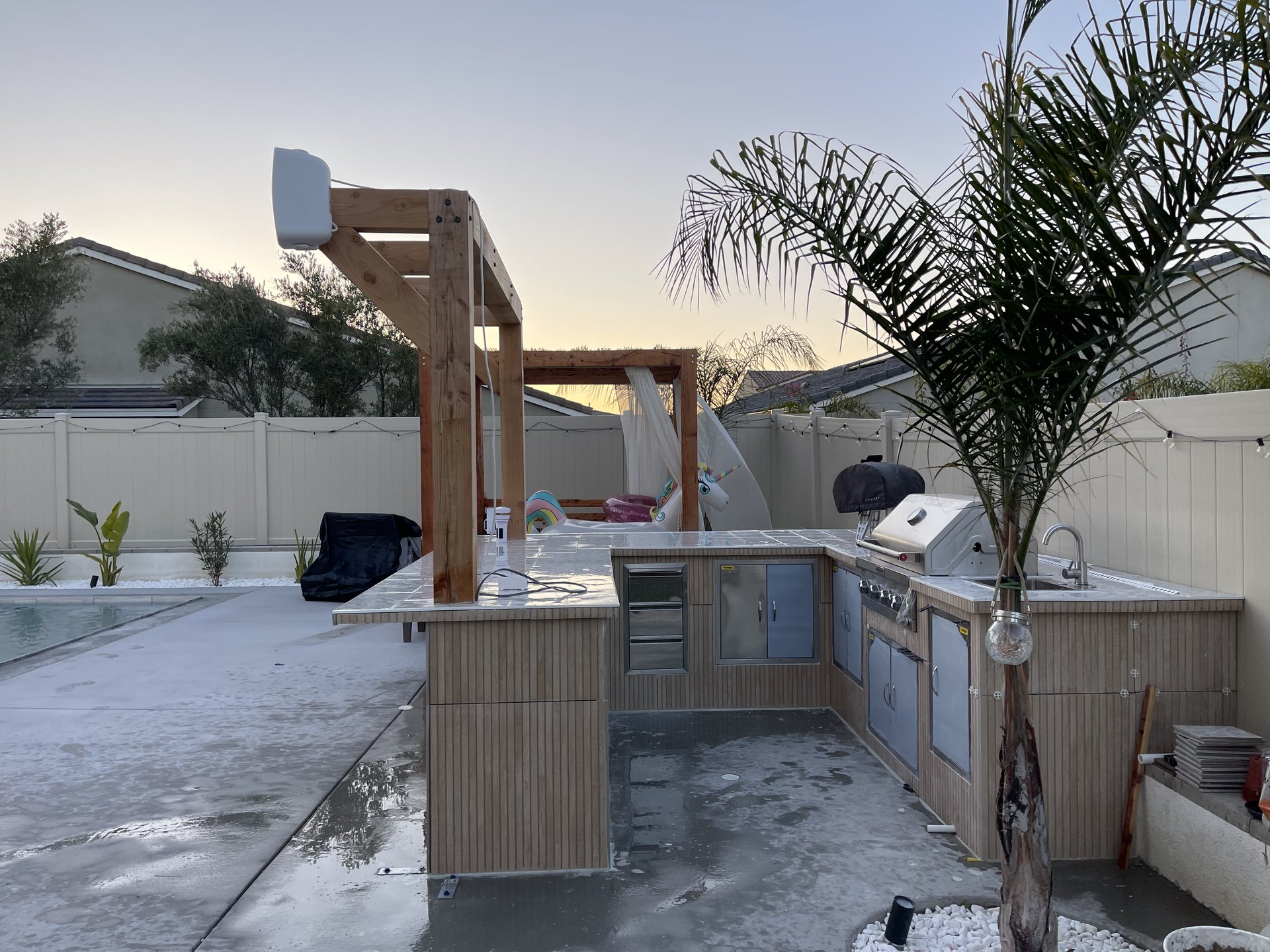 Pergola and outdoor kitchen at golden hour — Menifee