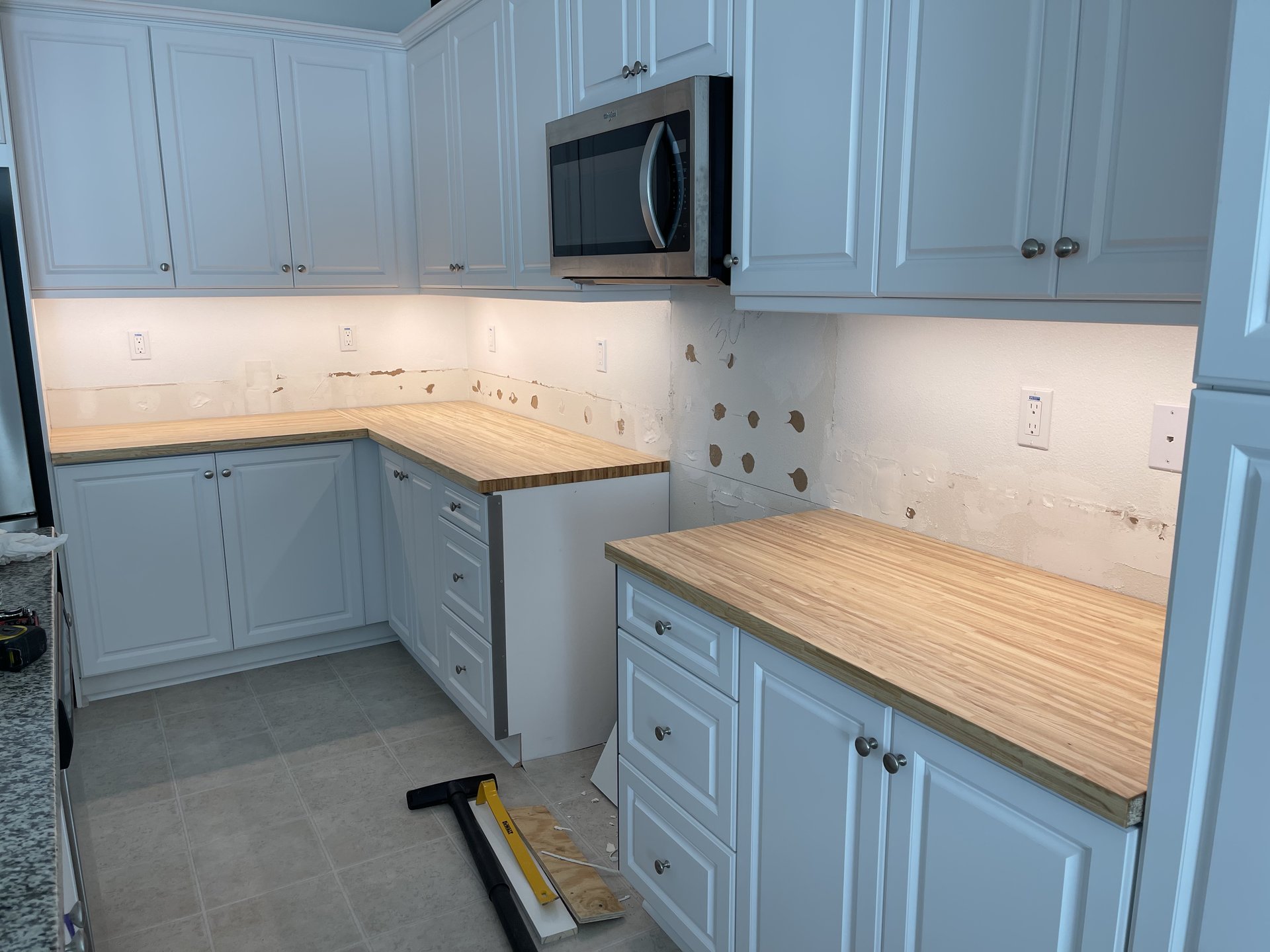 Counters removed, butcher block being fitted, backsplash demoed — Menifee