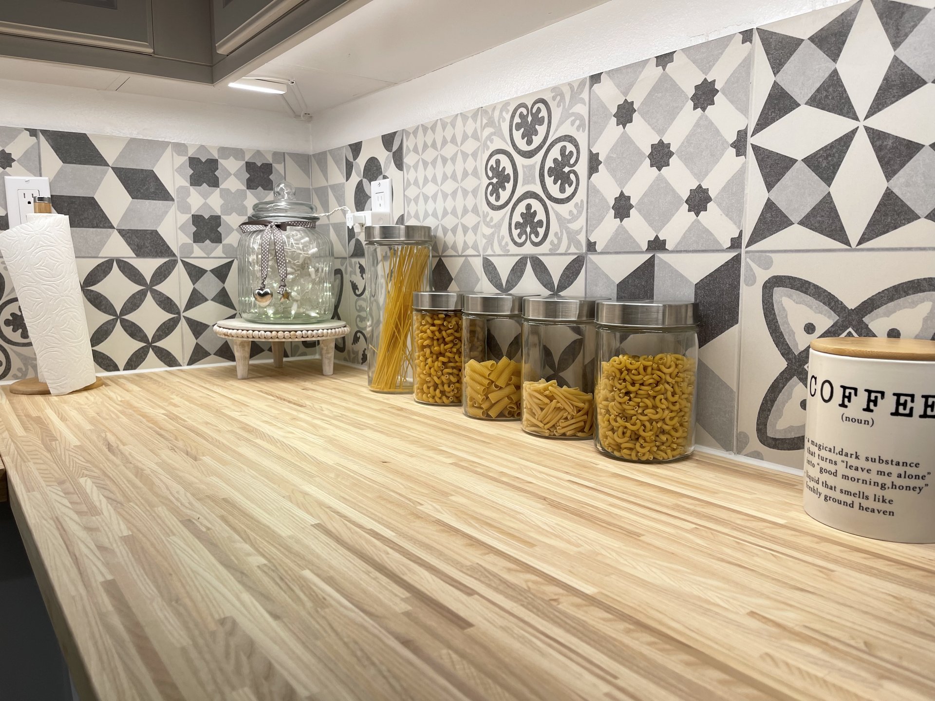Close-up of butcher block counter and cement-tile backsplash — Menifee