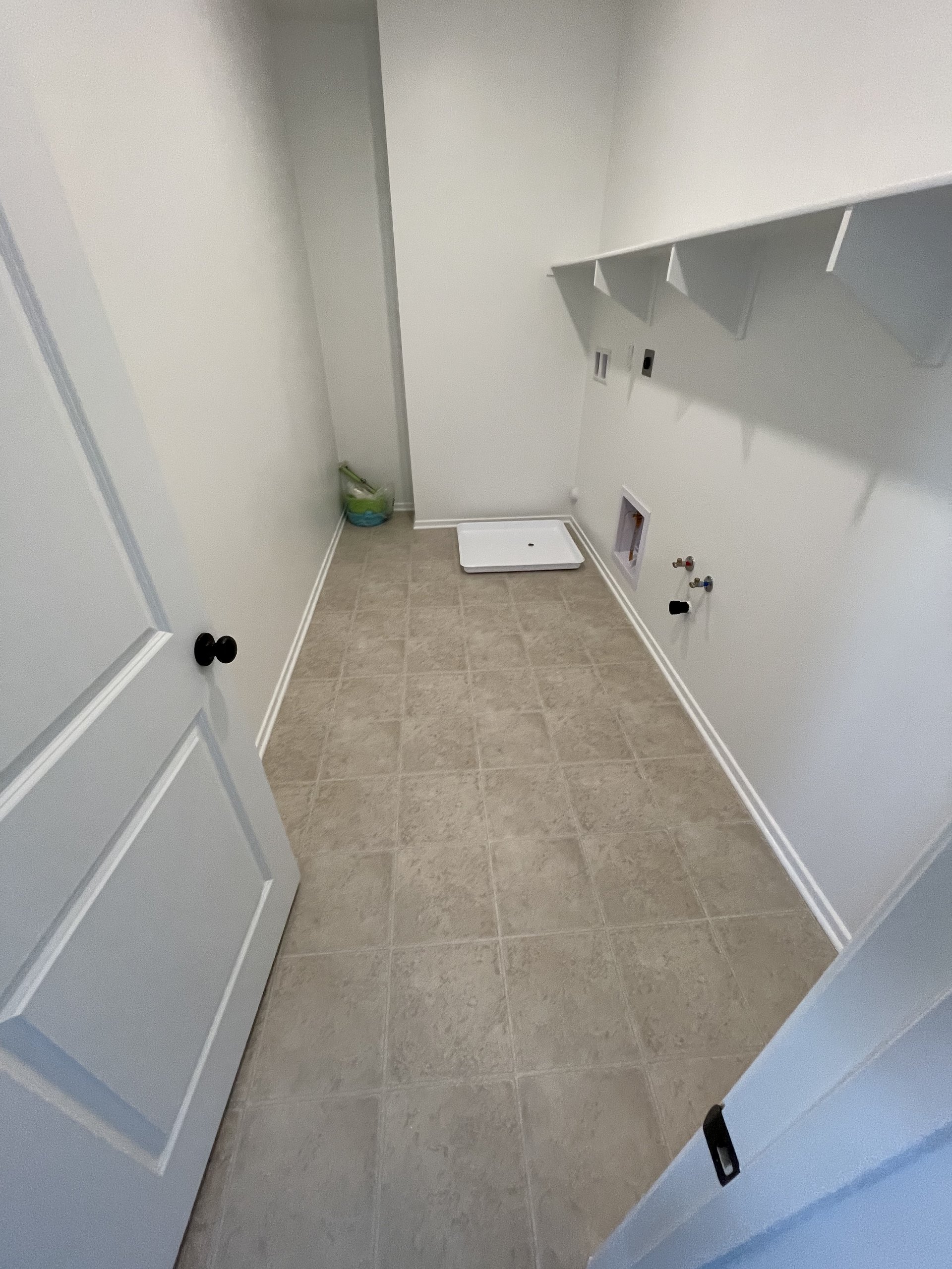 Original empty laundry room before renovation