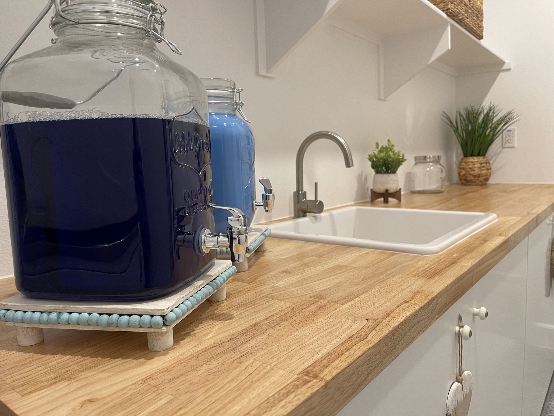 Close-up of the butcher block counter and farmhouse-style utility sink — Menifee