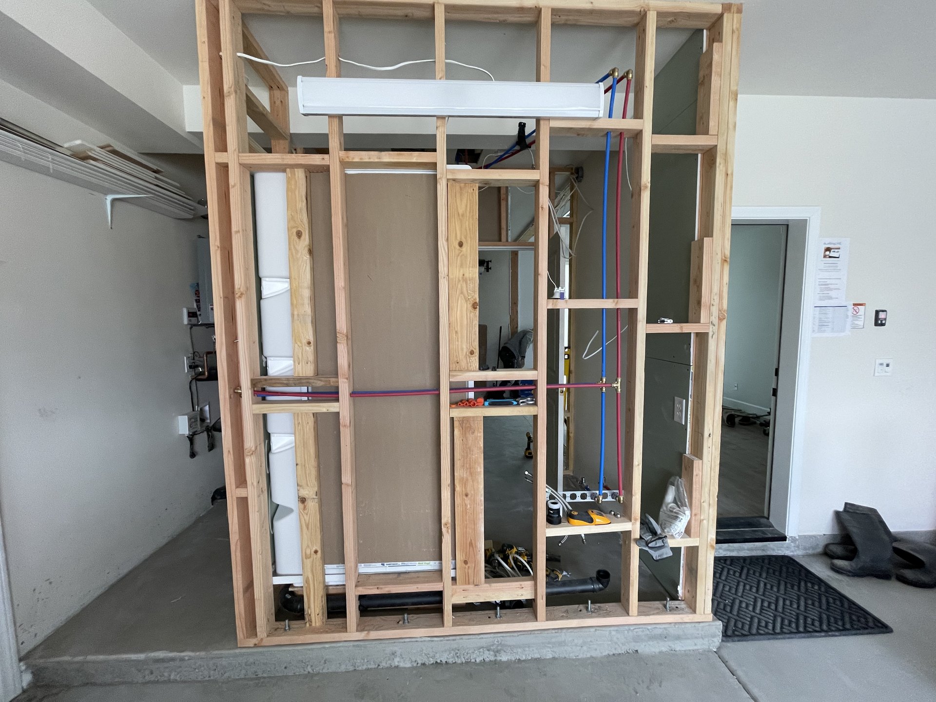 New bathroom framing with PEX plumbing in progress